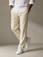 Light cream linen straight-fit trousers with side seams and drawstring at the waist