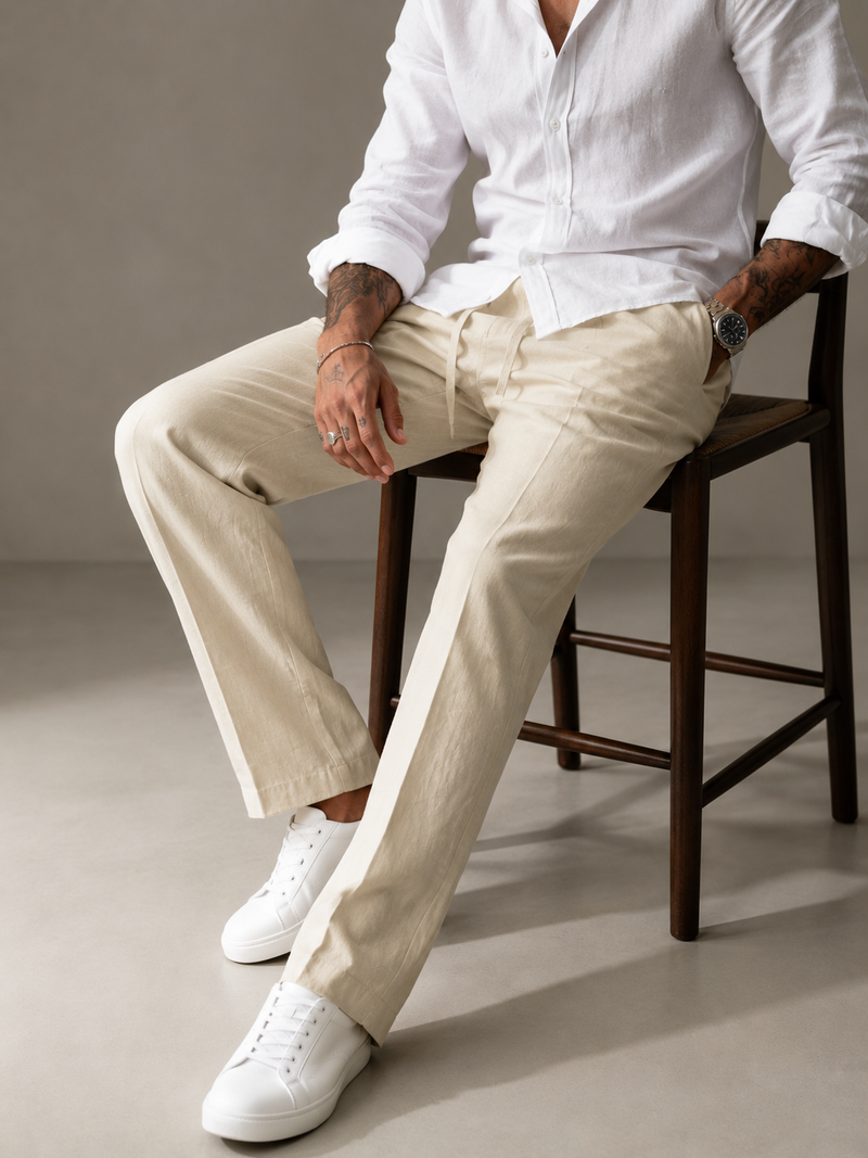 Light cream linen straight-fit trousers with detailed seam lines and relaxed knee fit