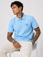 Powder blue structured-fit polo shirt with front contrast logo, short sleeves, seated