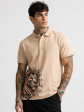 Beige polo shirt with embroidered logo and lion graphic, short sleeves