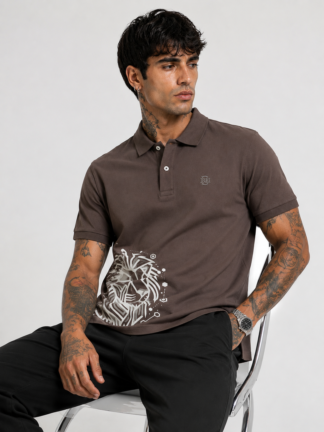 Brown polo T-shirt with short sleeves, button collar, and white lion artwork front