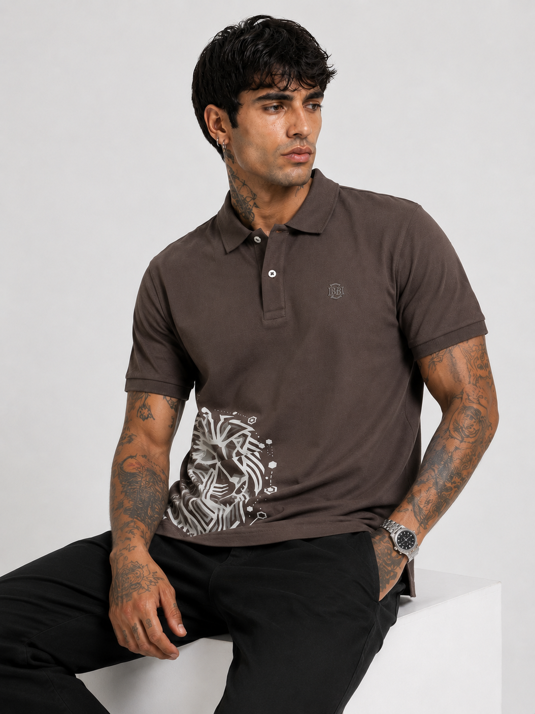 Brown polo T-shirt with button placket, chest logo, and white lion graphic