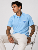 Powder blue structured-fit polo shirt with chest contrast logo, polo collar, seated