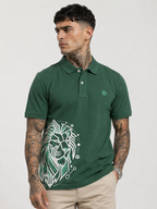 Green polo shirt with button placket and white lion graphic on chest