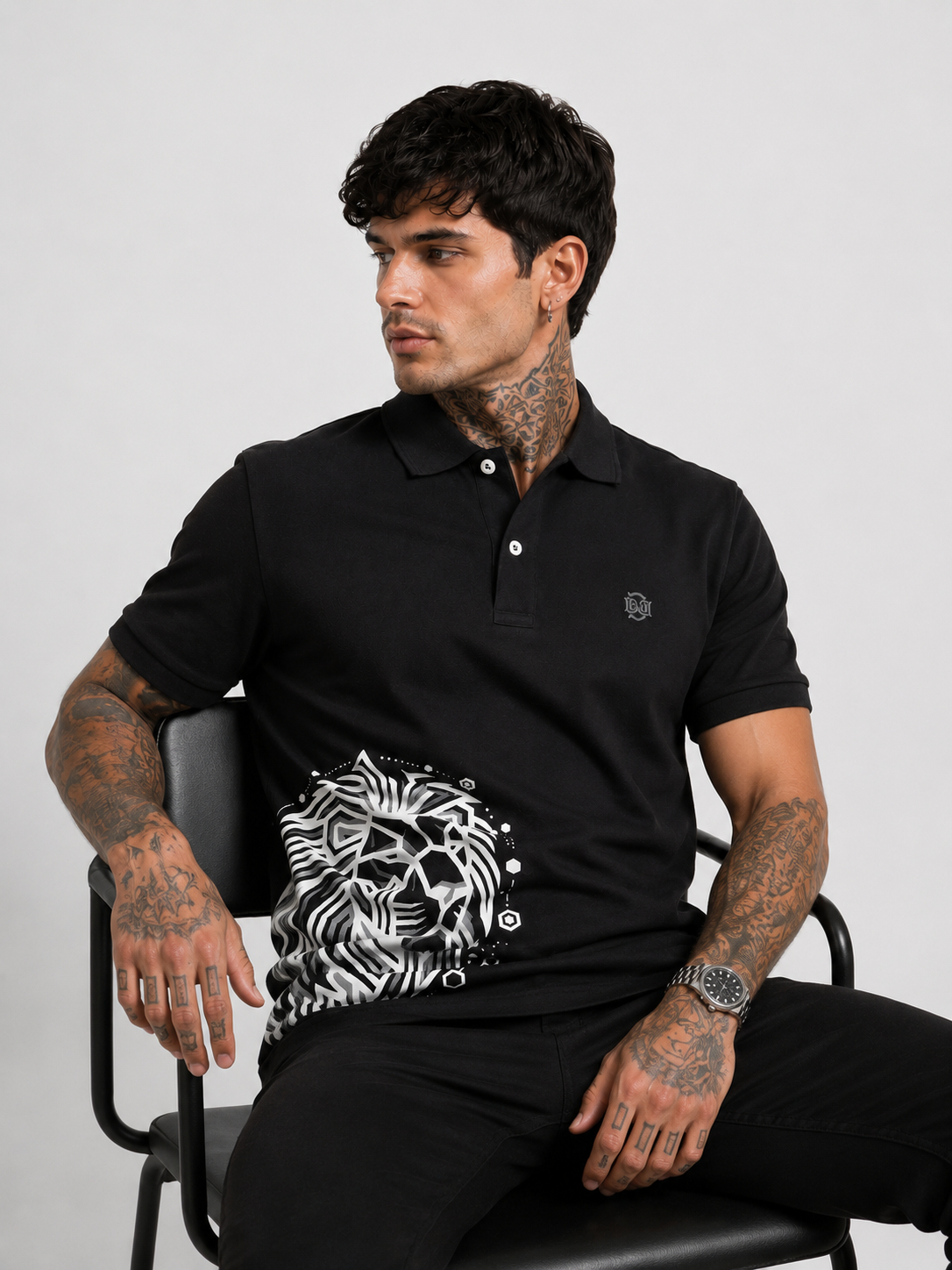 Black polo shirt with lion graphic on chest and small left-chest logo, buttoned collar