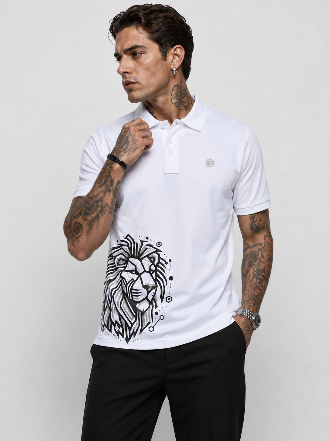 White polo shirt with button placket and black lion graphic on lower front
