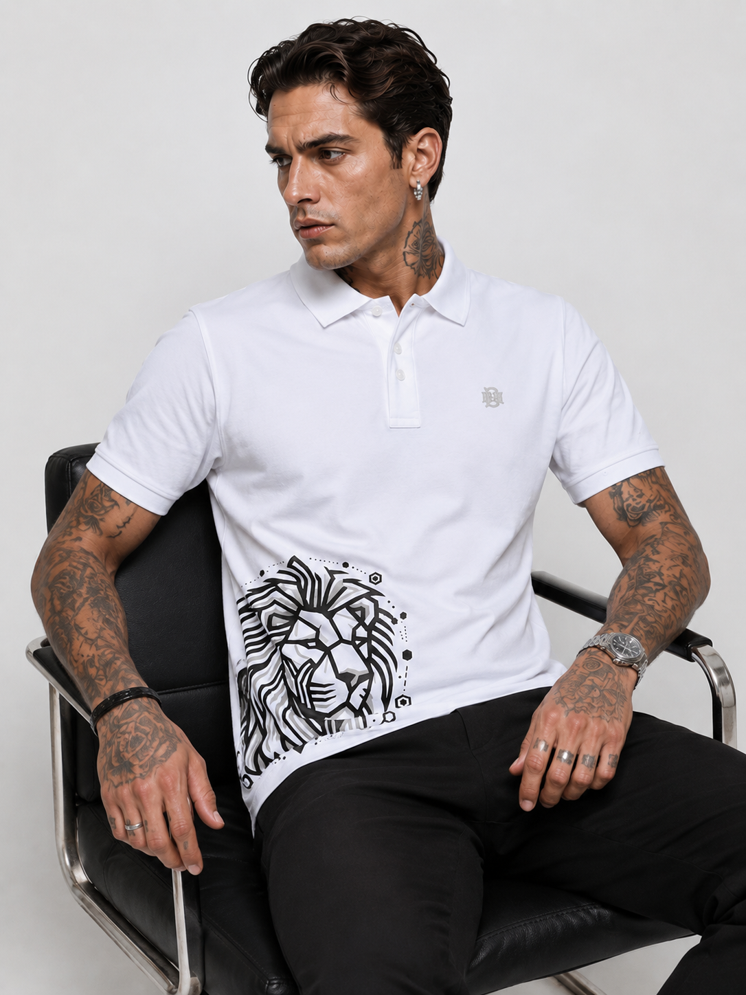 White polo shirt with logo at left chest and large black lion graphic panel