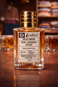 50ml Eau de Parfum bottle with gold cap and amber liquid, label facing camera
