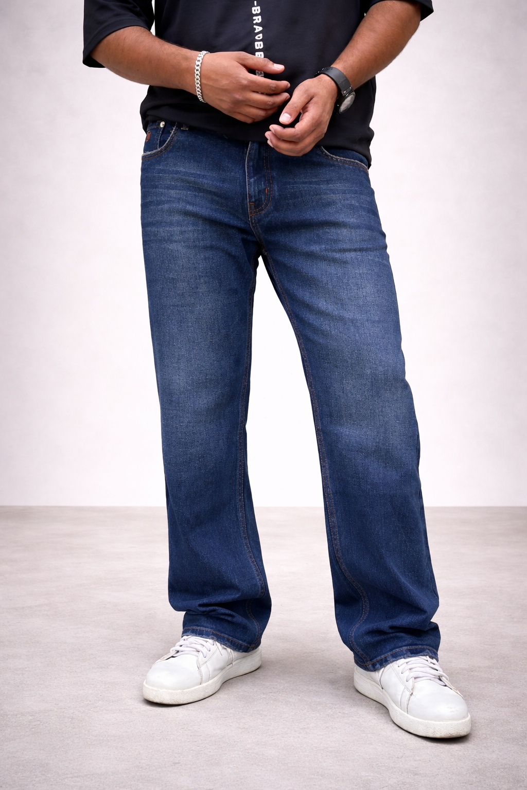 Dark indigo straight-leg jeans with whisker wash and five-pocket styling