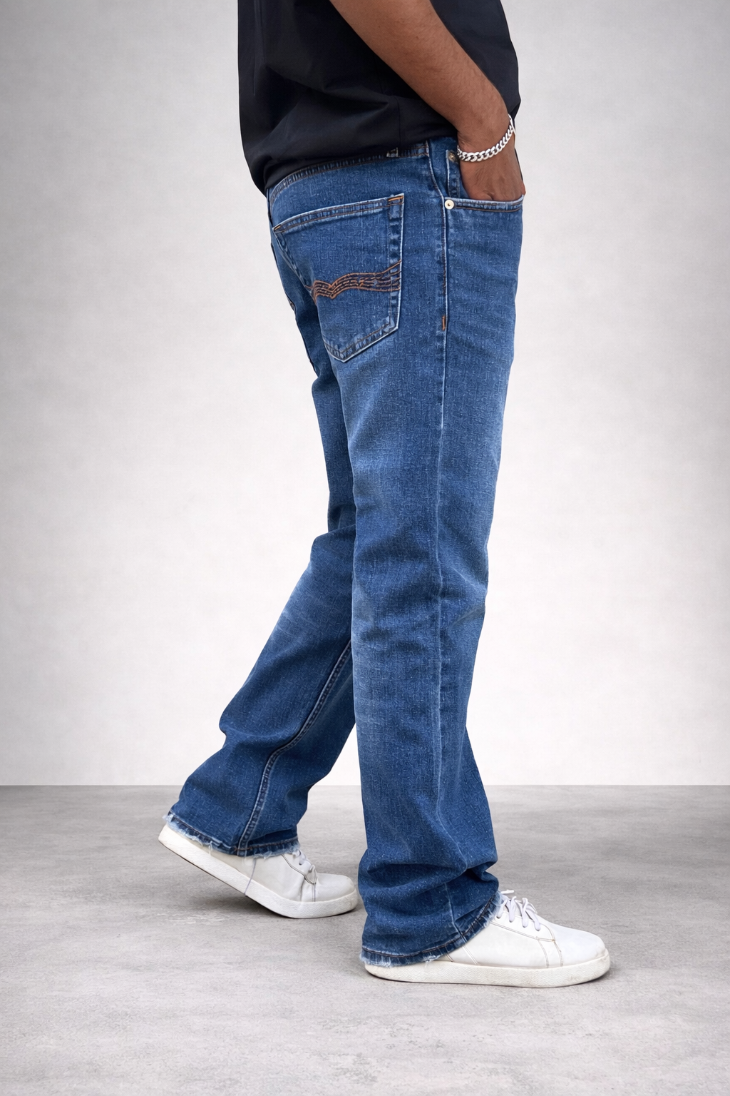 Sky blue straight-fit jeans in ocean wash denim; side view, cuffed hem
