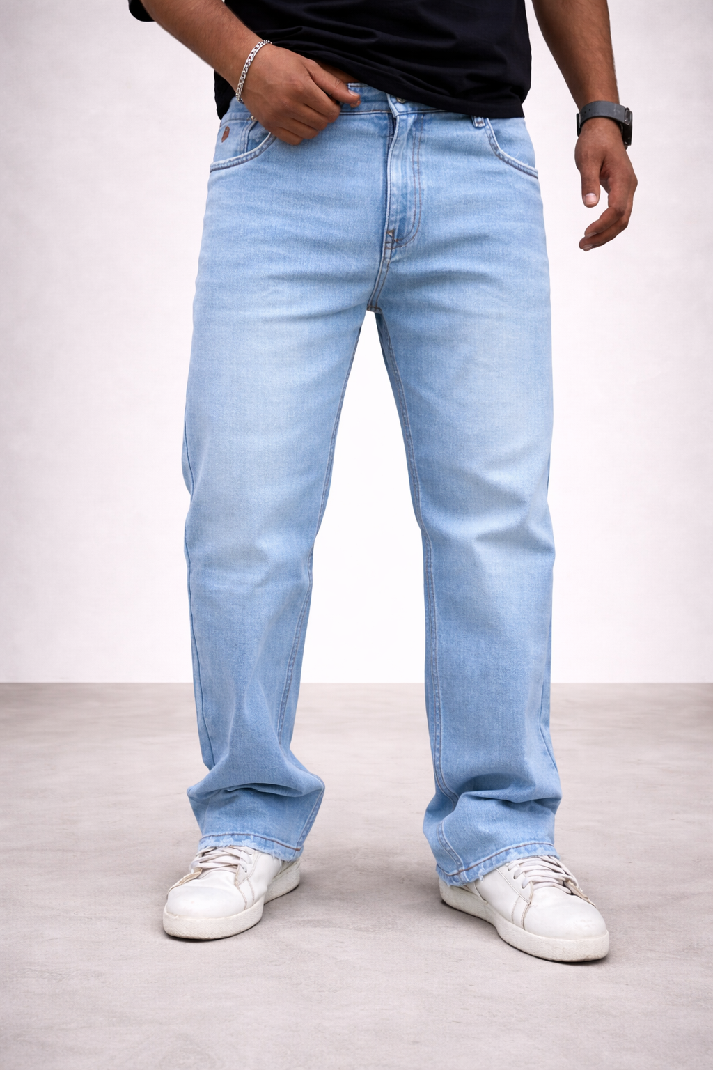 Ice blue light wash straight jeans, side view: stitched seams and front pocket detailing