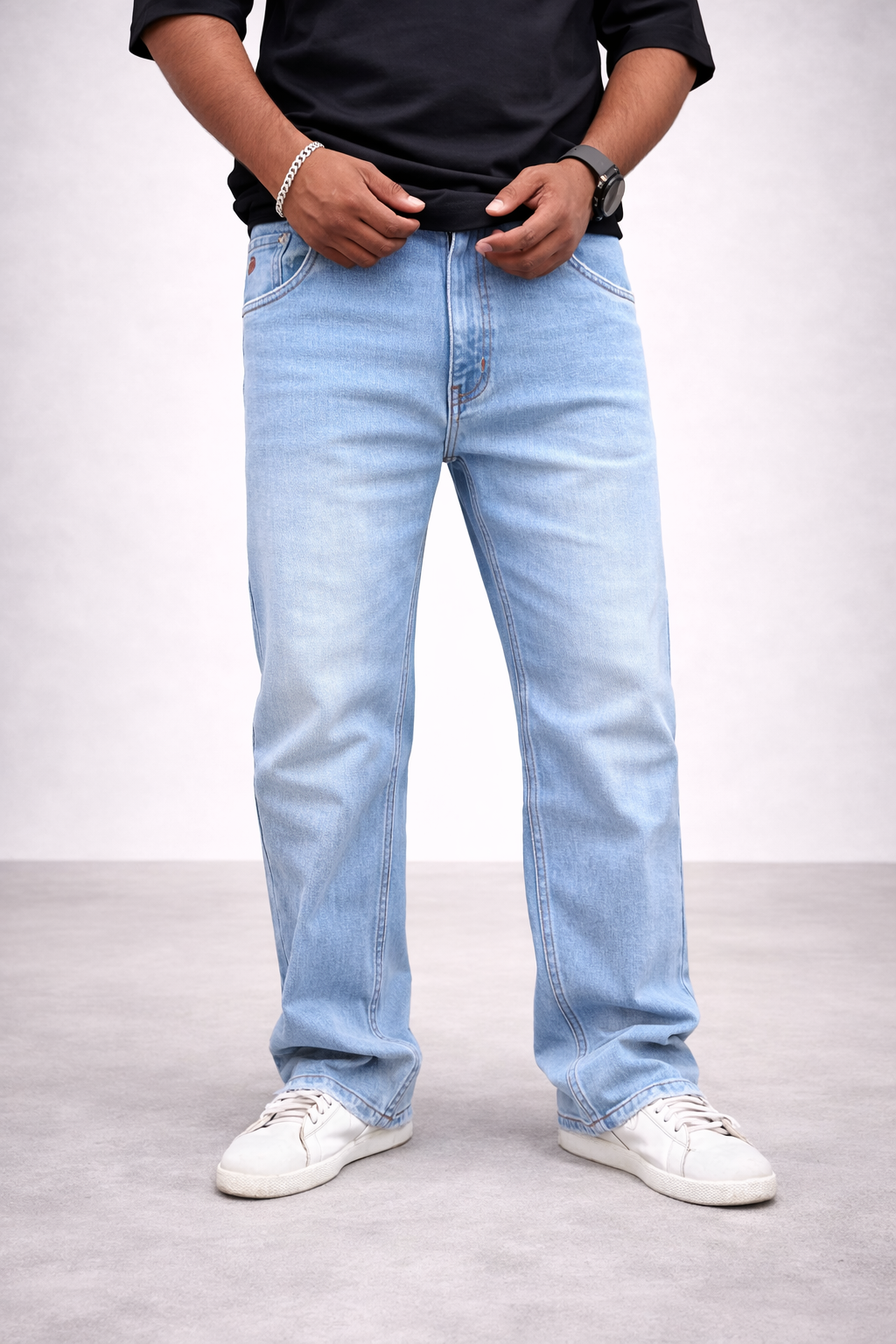Ice blue straight-fit jeans in light wash, button closure and belt loops shown at waist