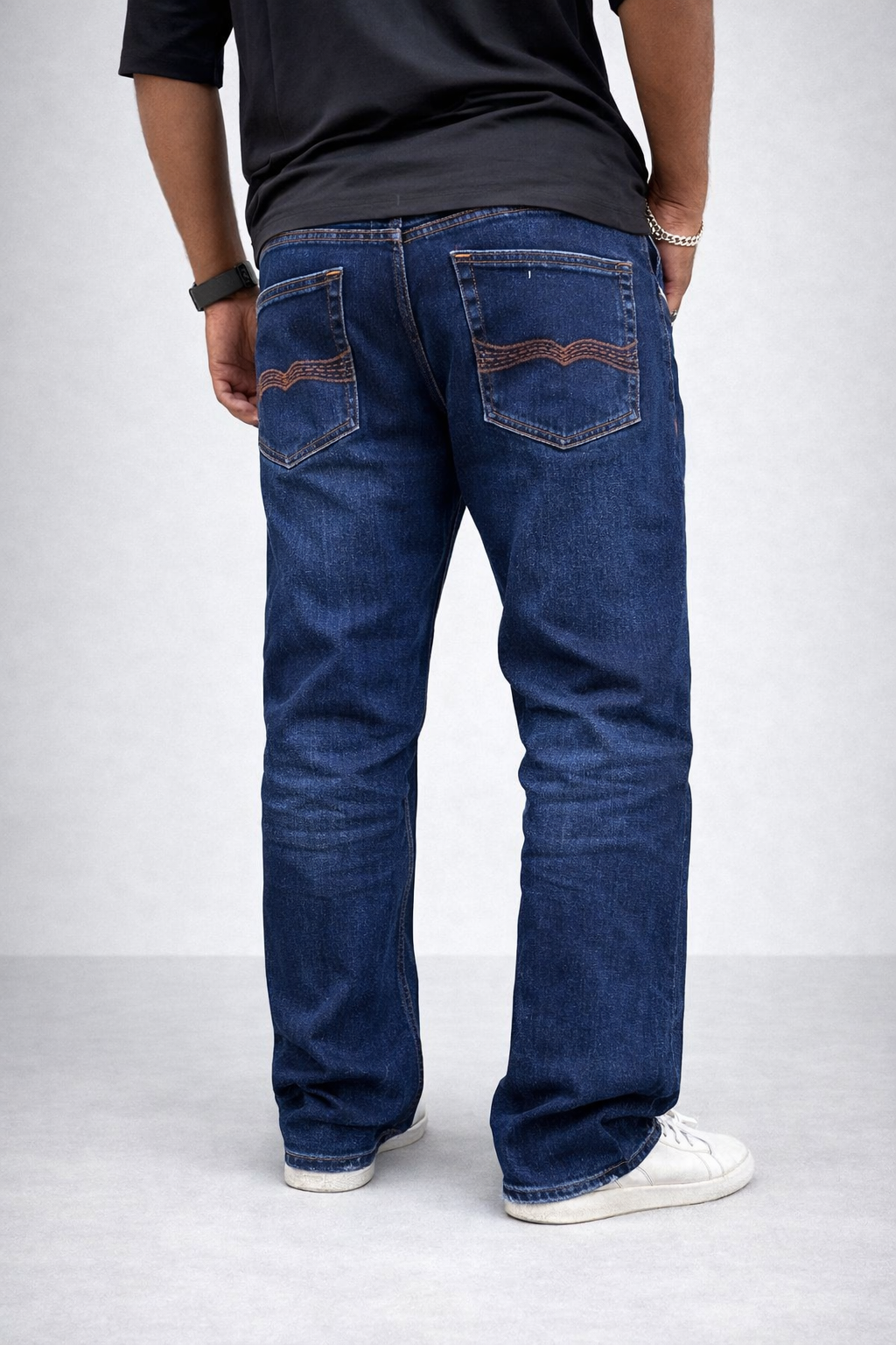 Back view: indigo stone-wash straight jeans with two rear patch pockets