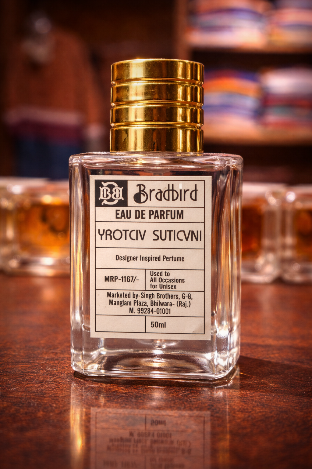 50 ml eau de parfum bottle with clear glass, gold cap, and front label
