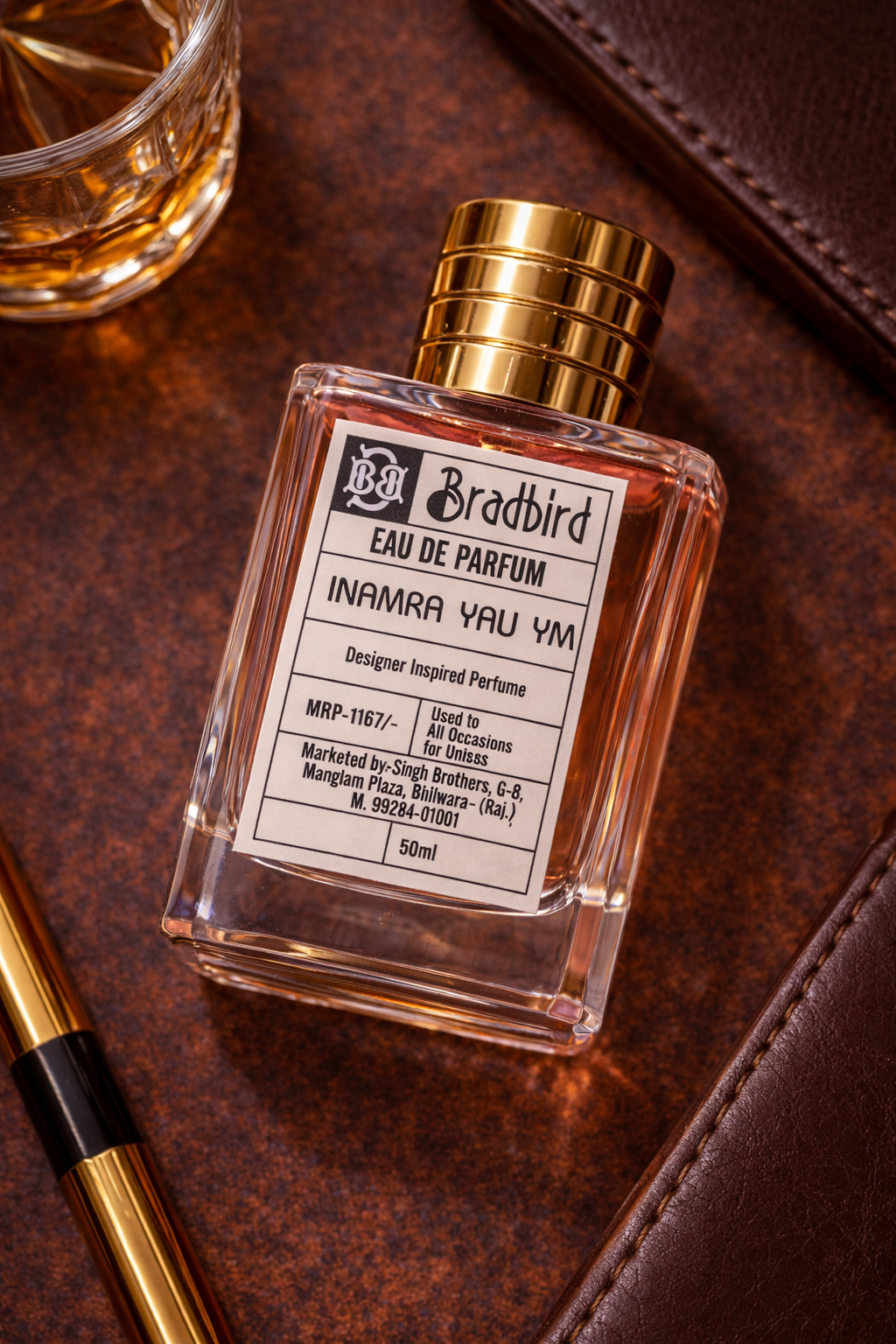 Inamra Yau YM Eau de Parfum 50ml bottle on leather, gold cap and label