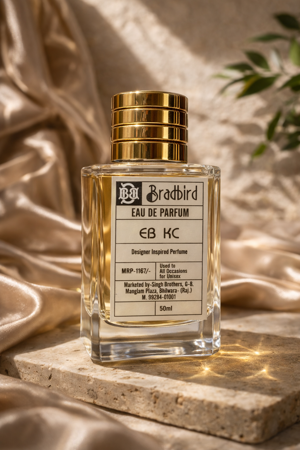 EB KC eau de parfum bottle with gold cap; clear glass, 50ml label visible