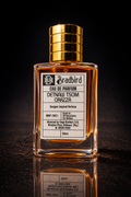 Eau de Parfum bottle with amber glass, gold ribbed cap, and front label