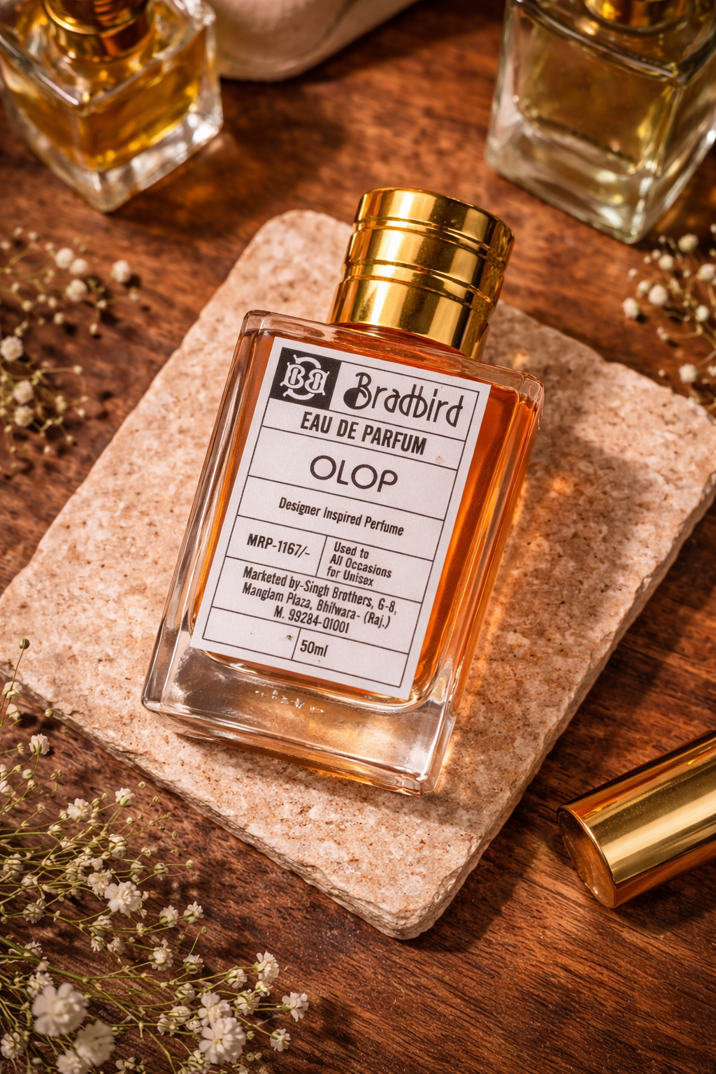 OLOP eau de parfum 50 ml bottle on stone slab, gold cap and label in view