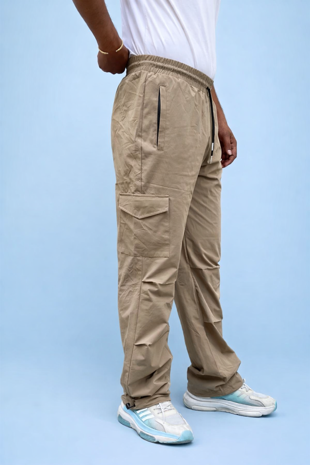 Beige cargo joggers with side utility pocket and adjustable ankle grip cuff