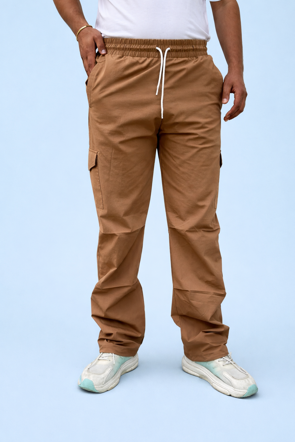 Brown cargo joggers with drawstring waist and ankle adjusters, side cargo pockets