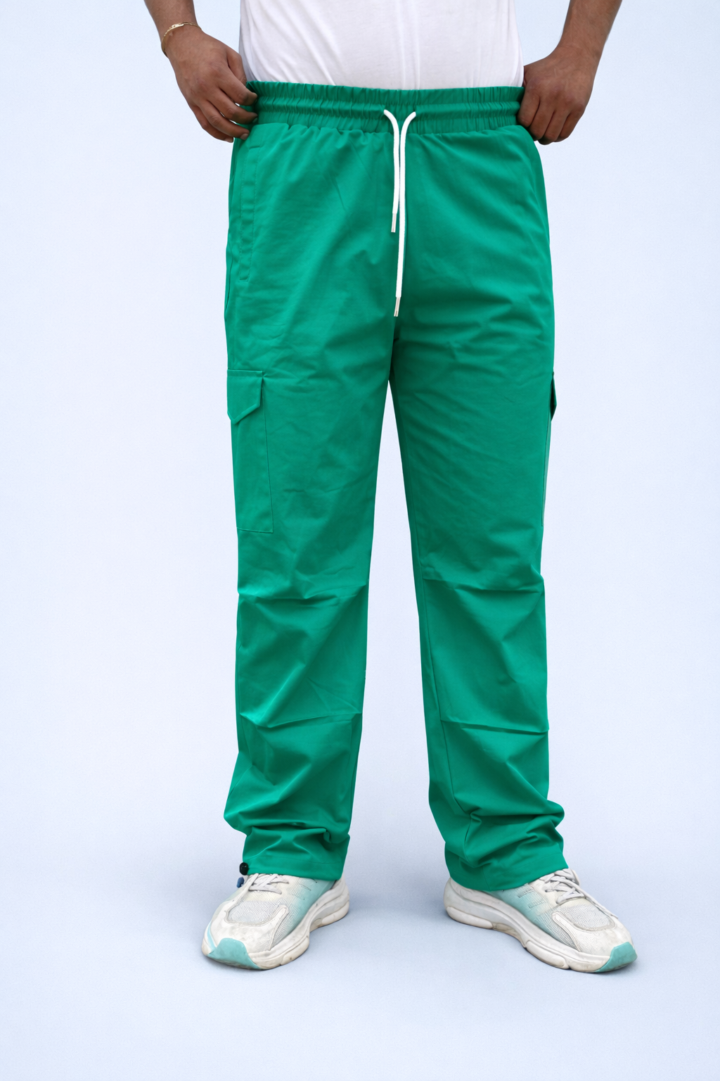 Green cargo joggers with white drawstring waist and side cargo pockets