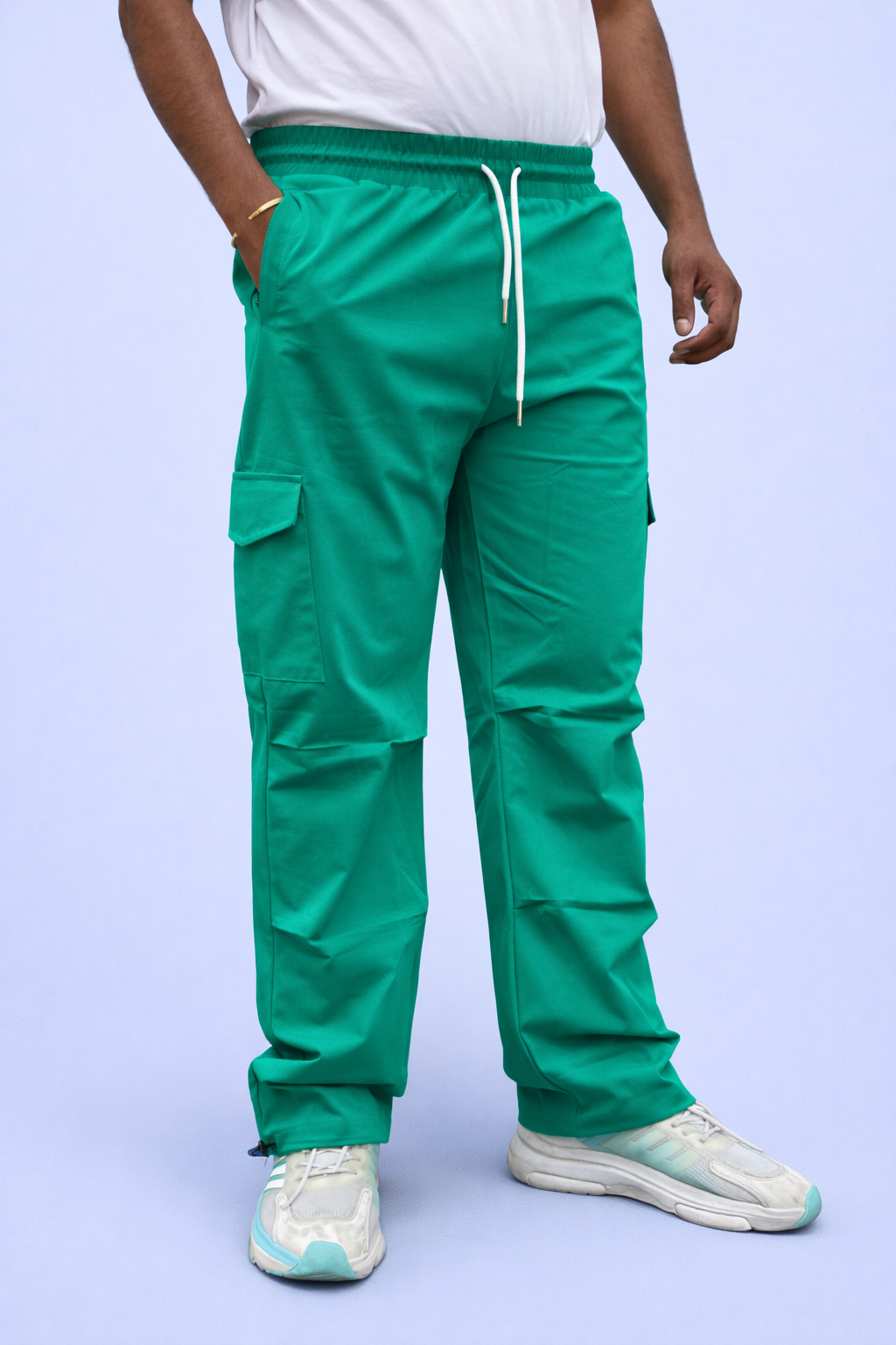 Green cargo joggers with elastic waistband, drawstring, and cargo pocket panels