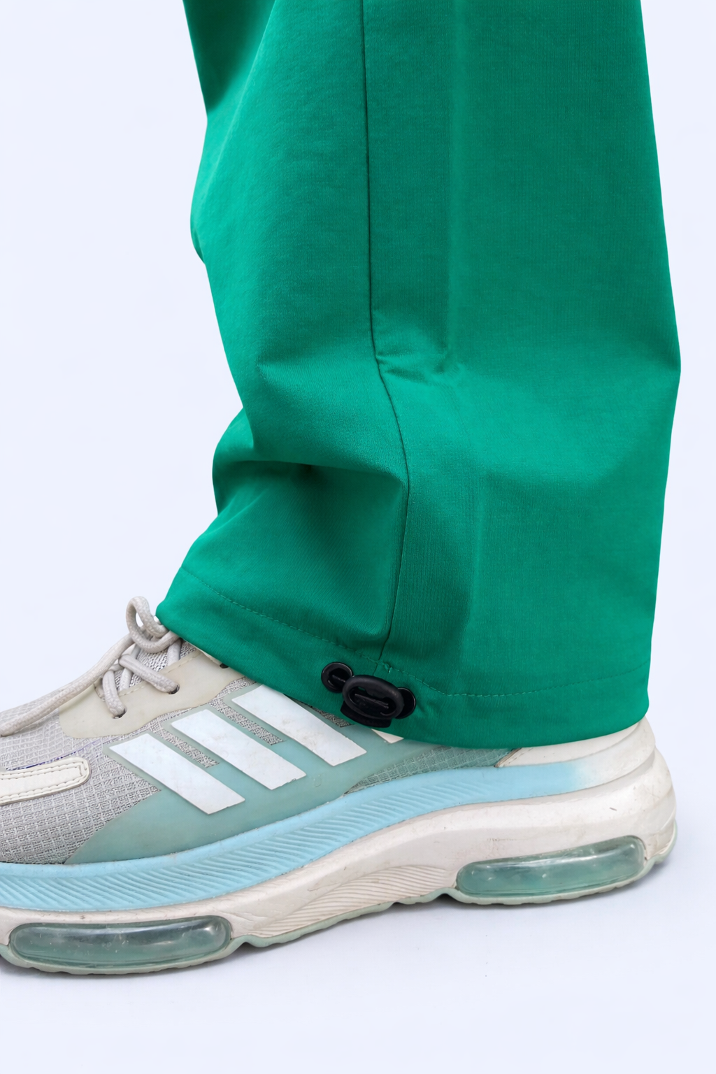 Green joggers ankle grip with adjustable cord toggle at cuff