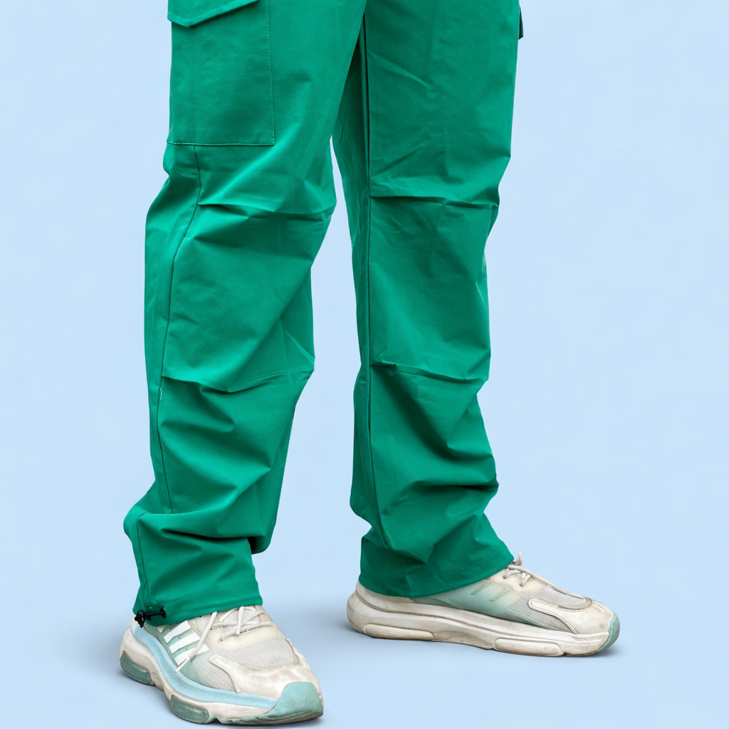 Green cargo joggers with knee crease and side cargo pocket detail, cuffed hem