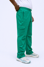Green cargo joggers rear view with side pockets and adjustable ankle cuff