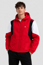 Scarlet red hooded windbreaker with black and white panels, front view
