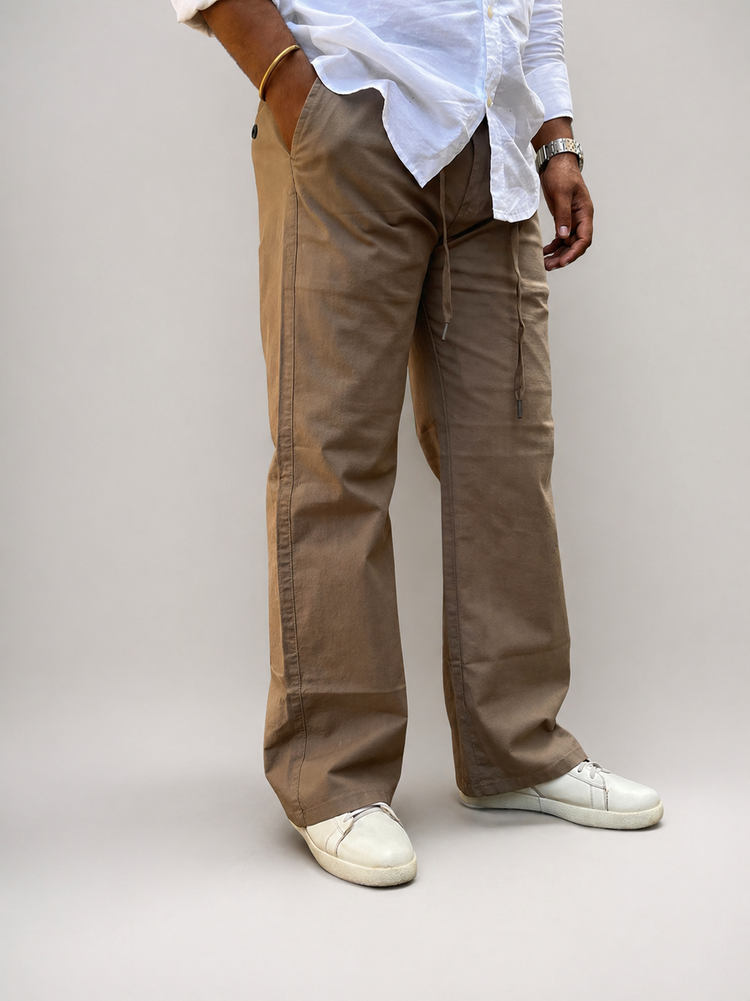 Tan-brown linen-cotton drawstring pants; relaxed straight cut with side pocket detail