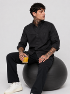 Black oxford button-up shirt with button front and tonal monogram, side view