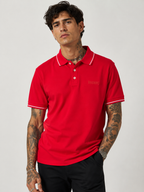Red polo shirt with two-button placket, contrast collar and sleeve cuffs, Bradbird logo