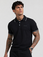 Black Bradbird polo T-shirt with white collar edging and neatly finished sleeve cuffs.