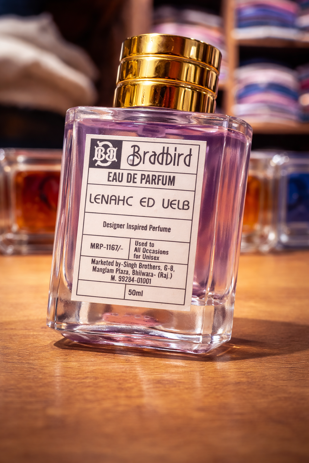 Eau de Parfum bottle with gold cap and printed label, 50ml, clear glass