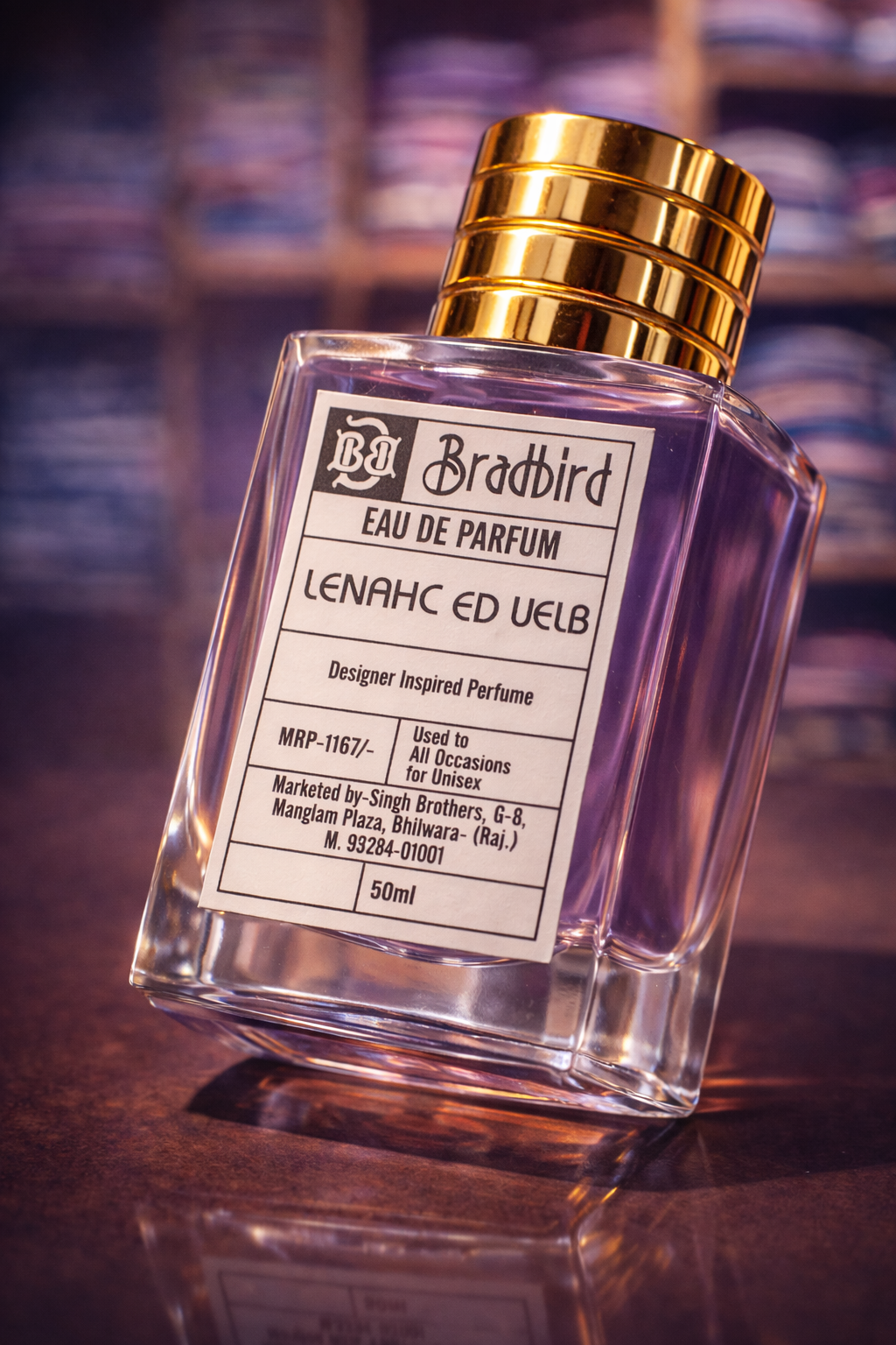 Bradbird Eau de Parfum bottle angled view, gold cap, clear glass, 50ml