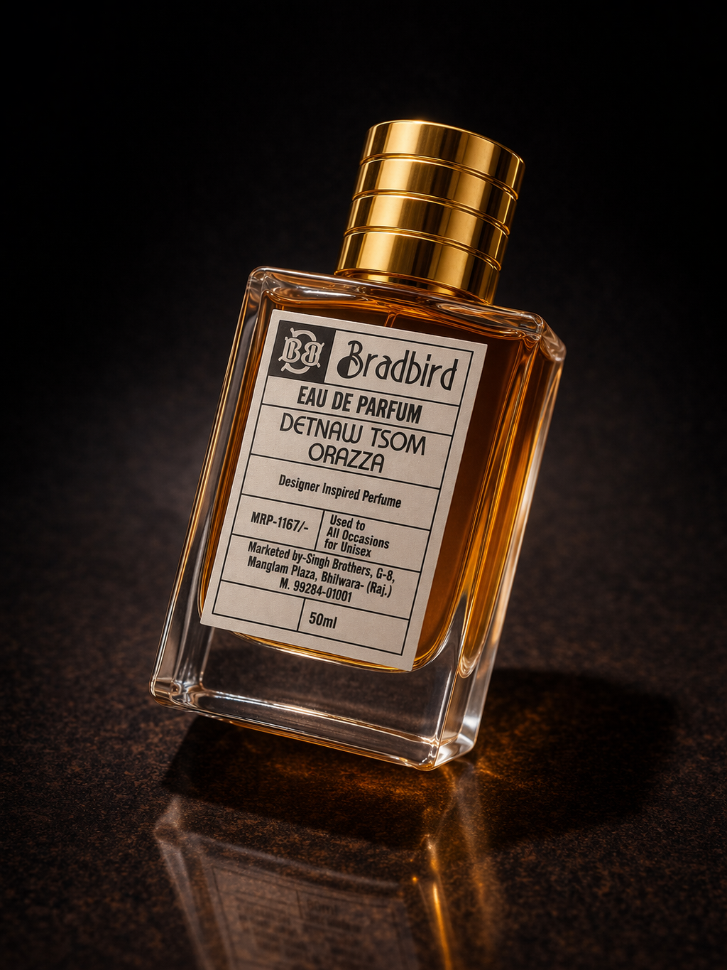 Eau de Parfum bottle in amber glass with gold ribbed cap, label facing left