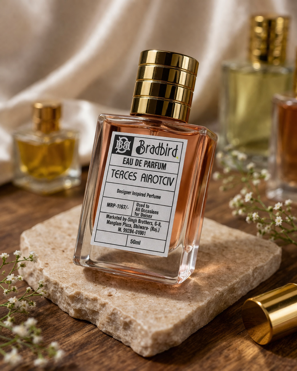 TERCES AIROTCIV eau de parfum, 50 ml; clear square bottle with gold cap on stone slab