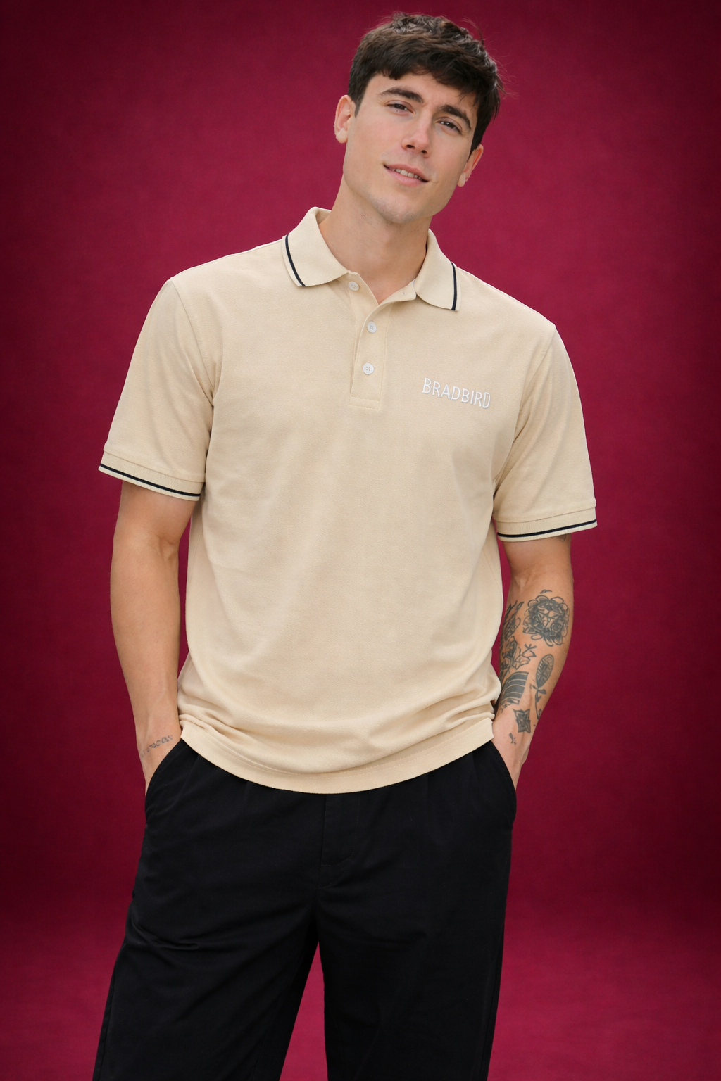 Cream polo shirt with navy tipped collar and sleeve trims