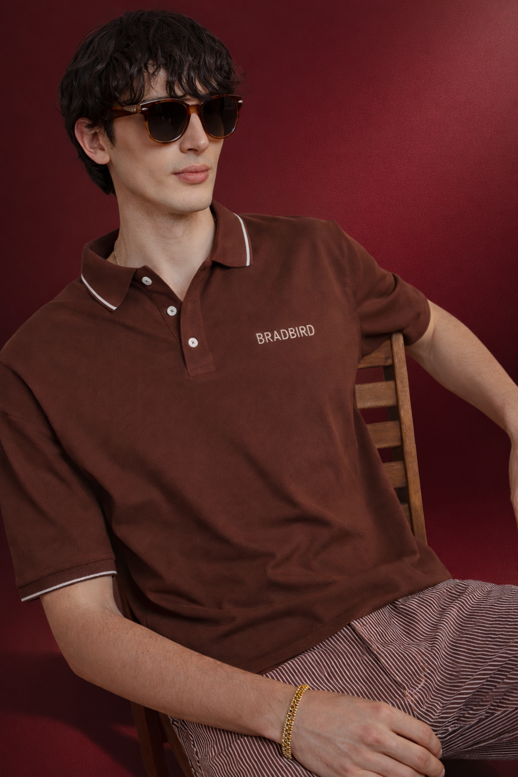 Brown pique polo shirt with white contrast tipping and button placket