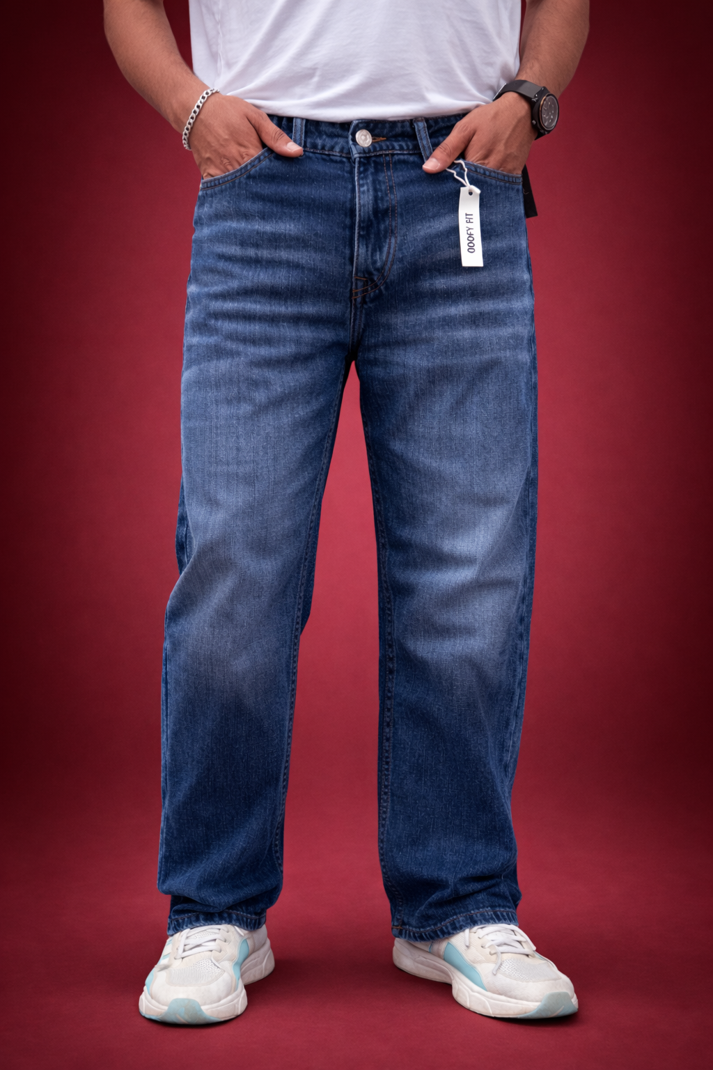 Indigo straight-fit jeans with button fly and belt loops, tag at waist, full length view.