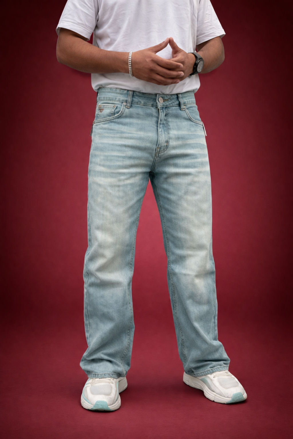 Light wash straight-fit jeans with mid-rise waistband and button closure