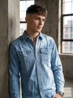 Light blue denim shirt with button front and two chest flap pockets