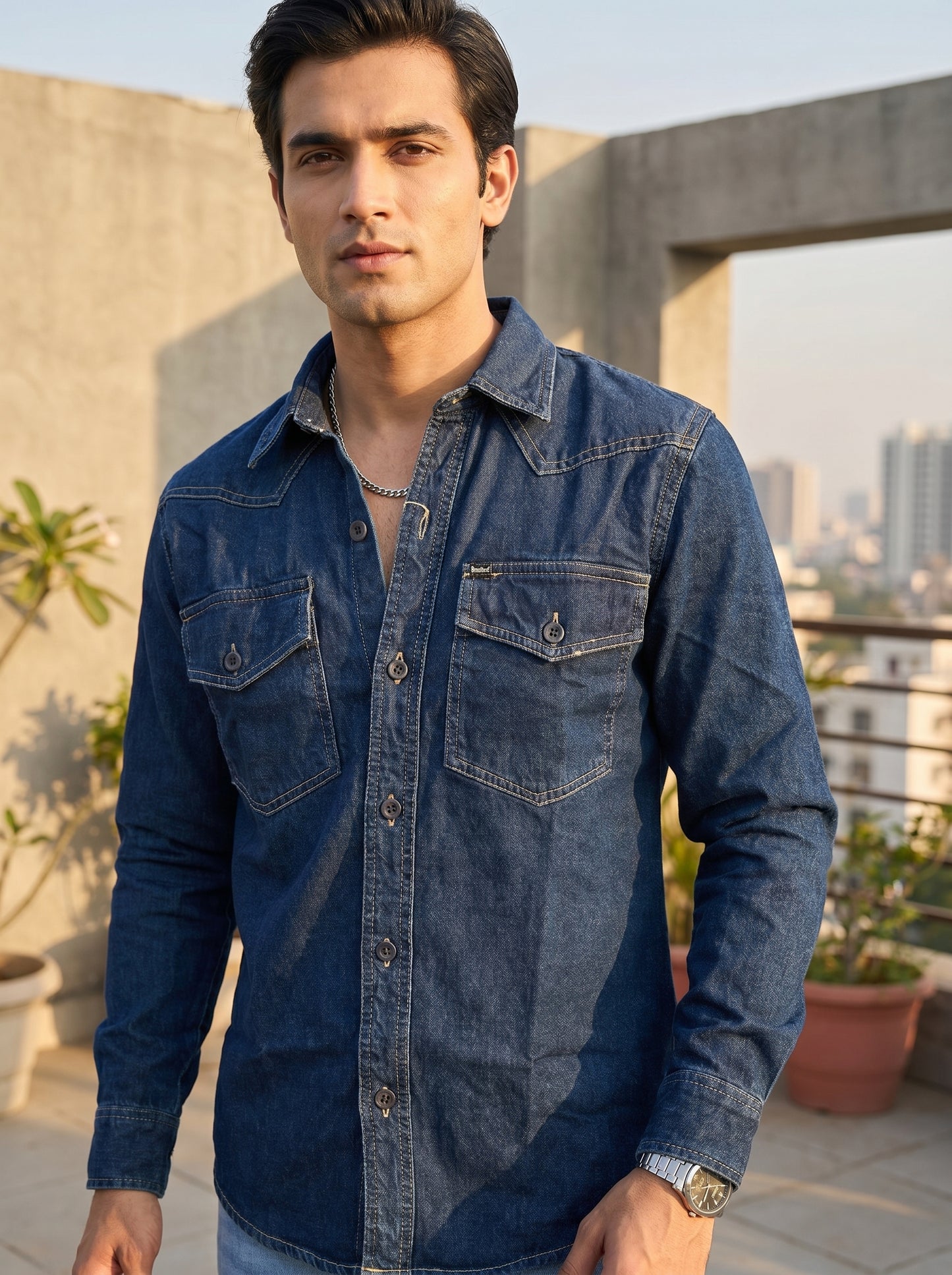 Blue denim western-style shirt with chest flap pockets and button front