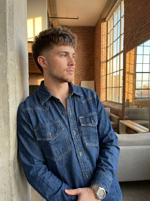 Blue denim western-style shirt with button placket and chest flap pockets