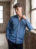 Medium wash denim western shirt with spread collar and flap chest pockets
