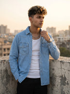 Light wash denim over-shirt with flap chest pockets and snap buttons, collared