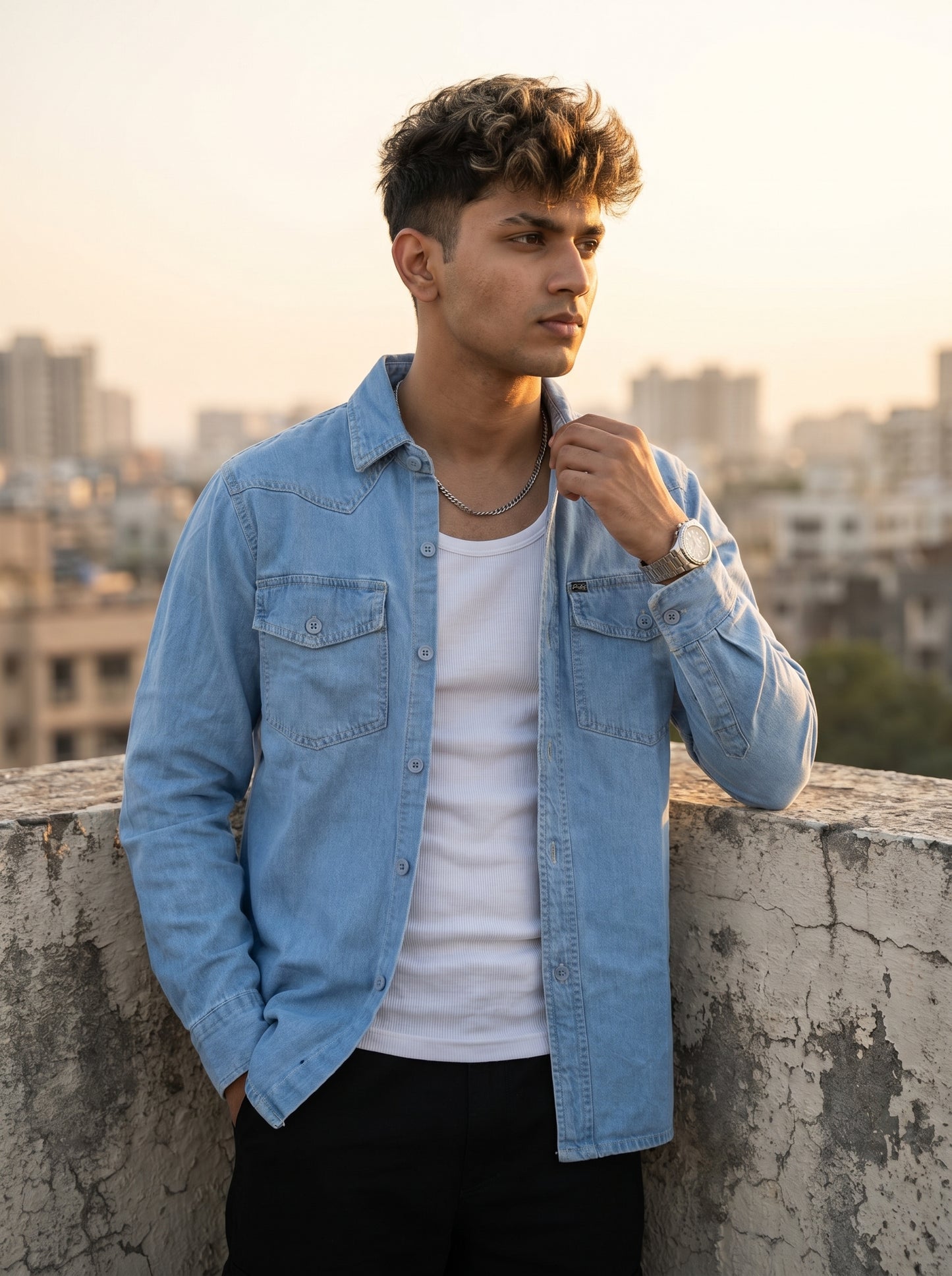 Light wash denim over-shirt with flap chest pockets and snap buttons, collared