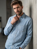 Ice blue denim shirt with long sleeves and single chest pocket on model