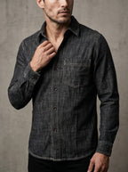 Deep grey denim shirt with button placket and chest pocket; contrast edge stitching detail